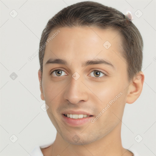 Joyful white young-adult male with short  brown hair and brown eyes