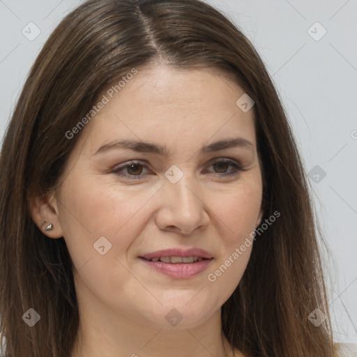 Joyful white adult female with long  brown hair and brown eyes