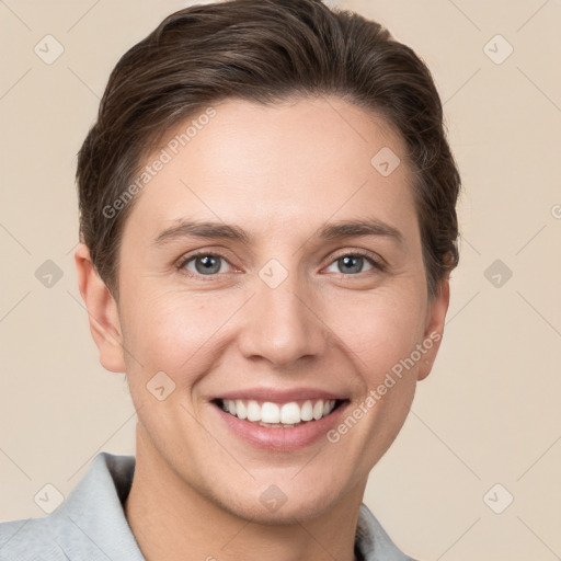 Joyful white young-adult female with short  brown hair and grey eyes