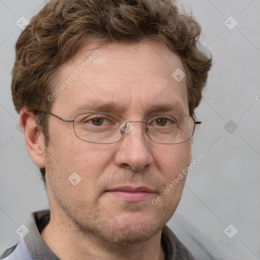 Joyful white adult male with short  brown hair and grey eyes