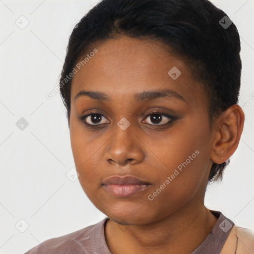 Neutral black young-adult female with short  black hair and brown eyes