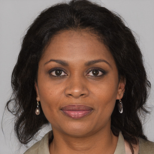 Joyful black young-adult female with medium  brown hair and brown eyes