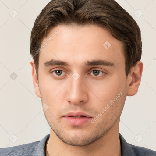 Neutral white young-adult male with short  brown hair and grey eyes