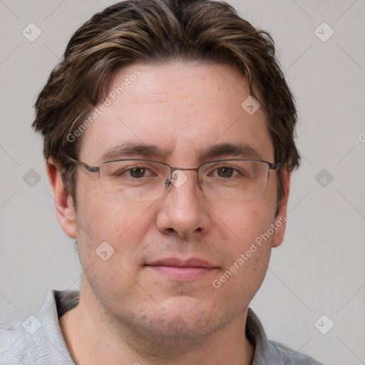 Joyful white adult male with short  brown hair and grey eyes