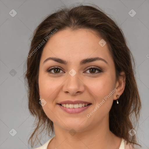 Joyful white young-adult female with medium  brown hair and brown eyes