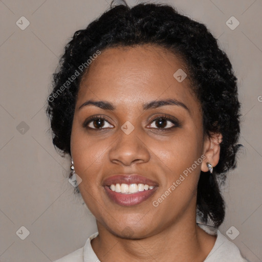 Joyful black young-adult female with medium  black hair and brown eyes