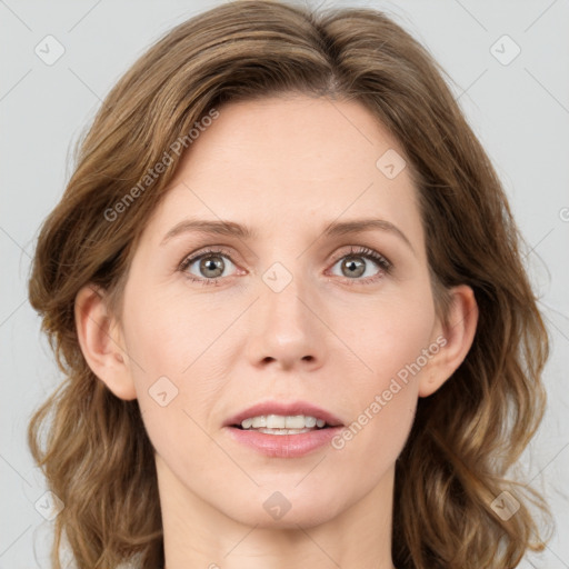 Joyful white adult female with medium  brown hair and blue eyes