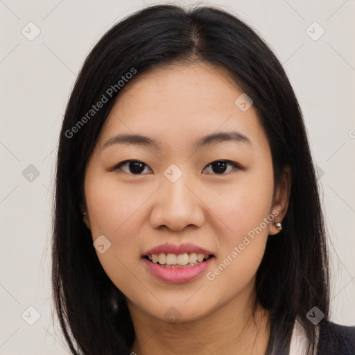 Joyful asian young-adult female with long  brown hair and brown eyes