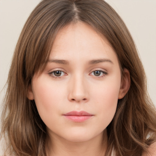 Neutral white young-adult female with long  brown hair and brown eyes