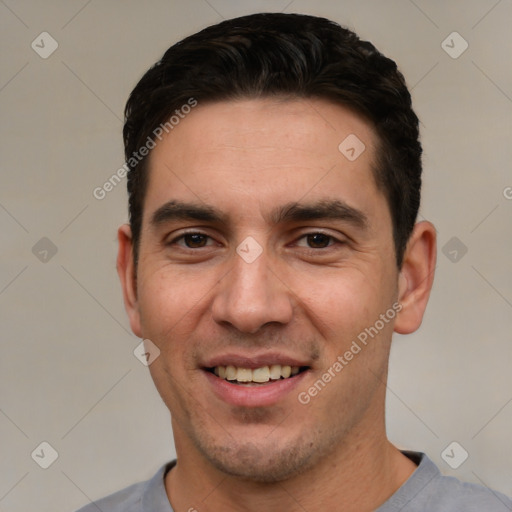 Joyful white young-adult male with short  black hair and brown eyes