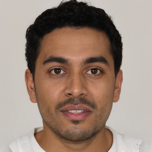 Neutral latino young-adult male with short  black hair and brown eyes