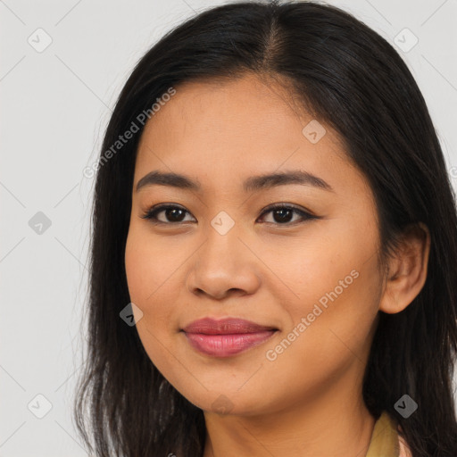 Joyful asian young-adult female with long  brown hair and brown eyes