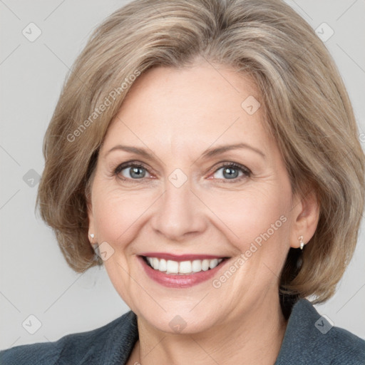 Joyful white adult female with medium  brown hair and grey eyes