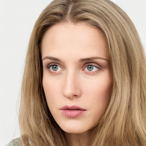 Neutral white young-adult female with long  brown hair and green eyes