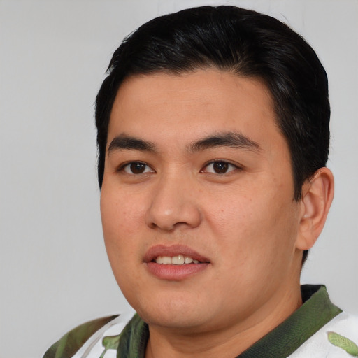 Joyful asian young-adult male with short  black hair and brown eyes