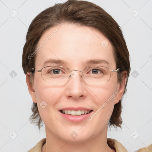 Joyful white adult female with medium  brown hair and grey eyes