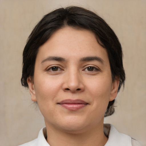 Joyful white young-adult female with medium  brown hair and brown eyes