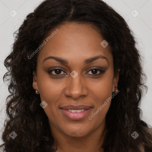 Joyful black young-adult female with long  brown hair and brown eyes
