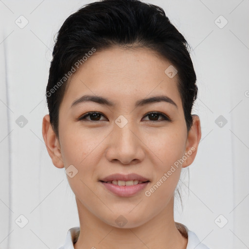 Joyful asian young-adult female with short  black hair and brown eyes