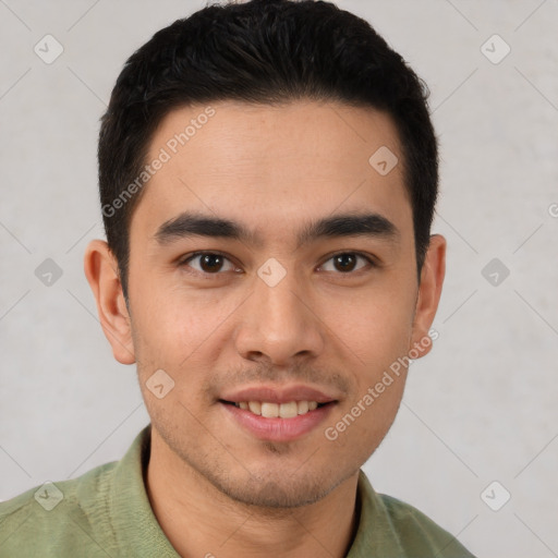 Joyful latino young-adult male with short  brown hair and brown eyes