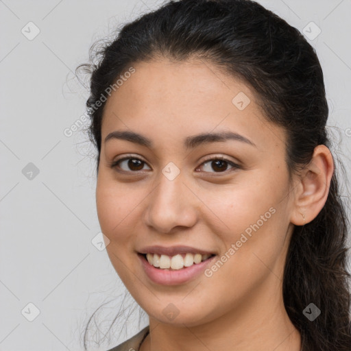 Joyful white young-adult female with long  brown hair and brown eyes