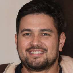 Joyful white adult male with short  brown hair and brown eyes