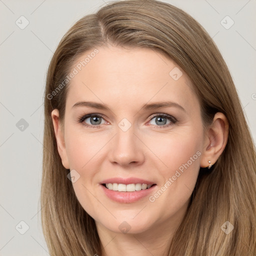 Joyful white young-adult female with long  brown hair and grey eyes