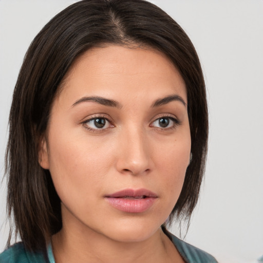 Neutral white young-adult female with medium  brown hair and brown eyes