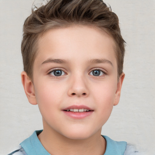 Joyful white child female with short  brown hair and grey eyes