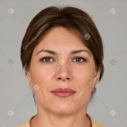 Joyful white adult female with short  brown hair and brown eyes