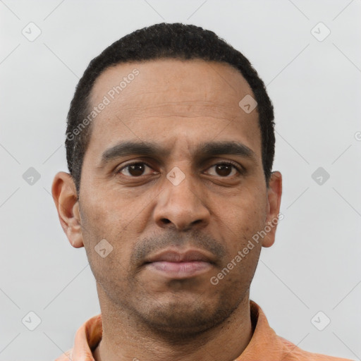 Neutral latino young-adult male with short  brown hair and brown eyes