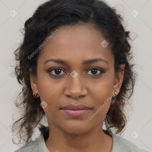 Joyful black young-adult female with long  brown hair and brown eyes