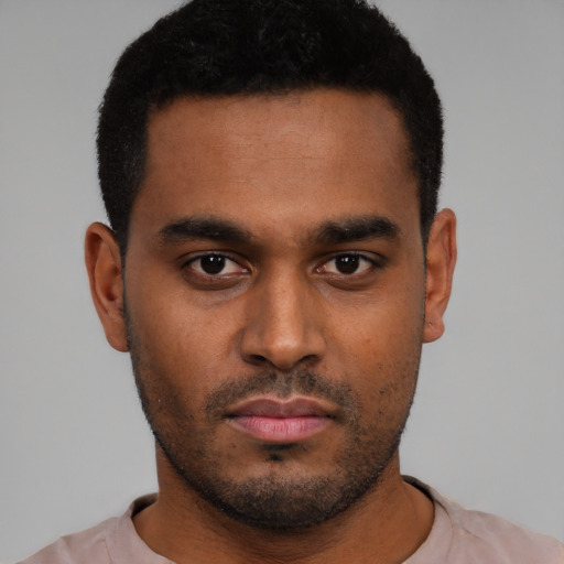 Neutral black young-adult male with short  black hair and brown eyes