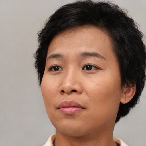 Neutral asian young-adult female with medium  black hair and brown eyes