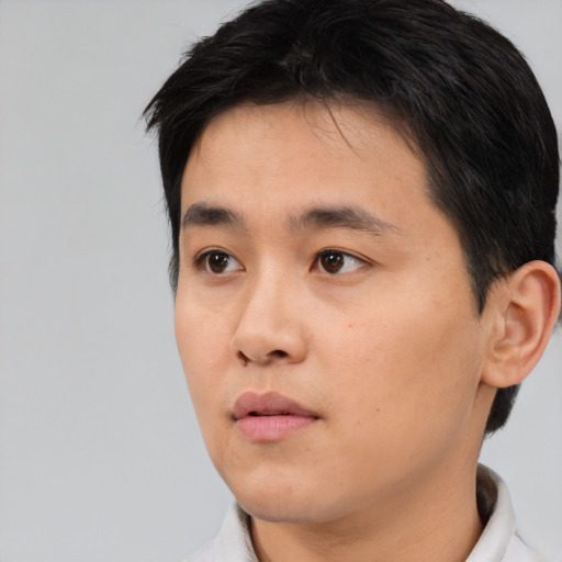 Neutral asian young-adult male with short  black hair and brown eyes