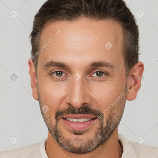 Joyful white adult male with short  brown hair and brown eyes