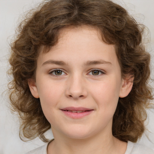 Joyful white child female with medium  brown hair and brown eyes