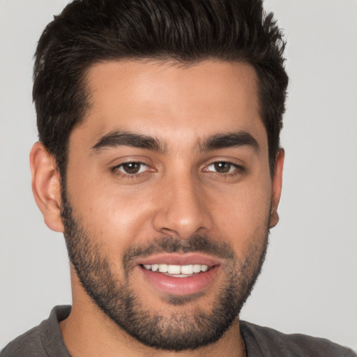 Joyful white young-adult male with short  brown hair and brown eyes