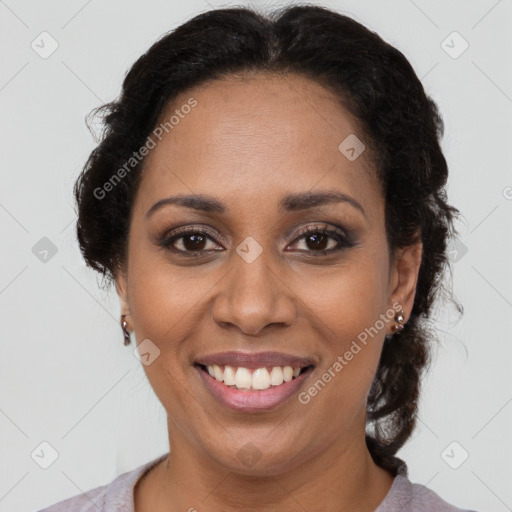 Joyful latino adult female with short  brown hair and brown eyes