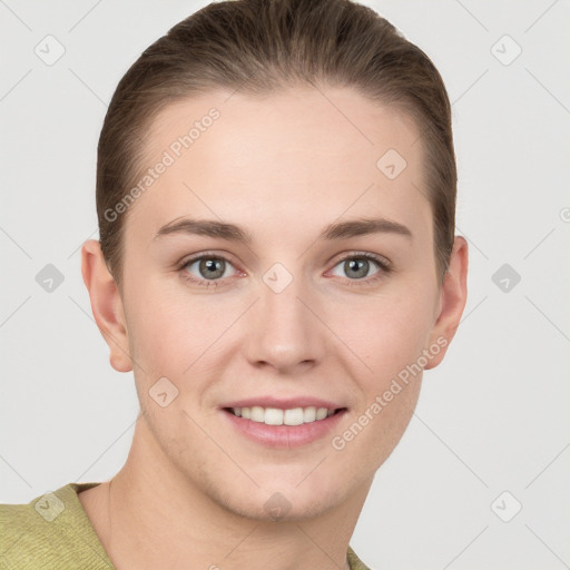 Joyful white young-adult female with short  brown hair and grey eyes