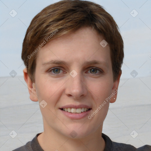 Joyful white young-adult female with short  brown hair and grey eyes