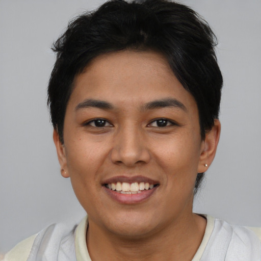Joyful asian young-adult female with short  brown hair and brown eyes