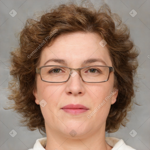 Joyful white adult female with medium  brown hair and green eyes