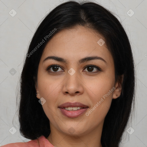 Joyful latino young-adult female with long  brown hair and brown eyes