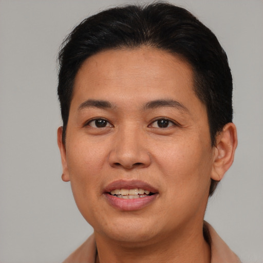 Joyful asian adult female with short  brown hair and brown eyes