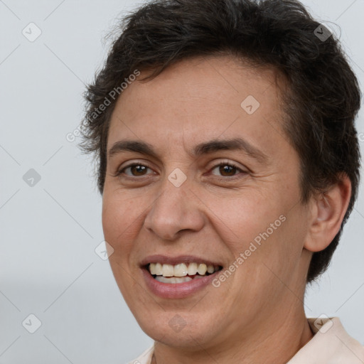 Joyful white adult female with short  brown hair and brown eyes