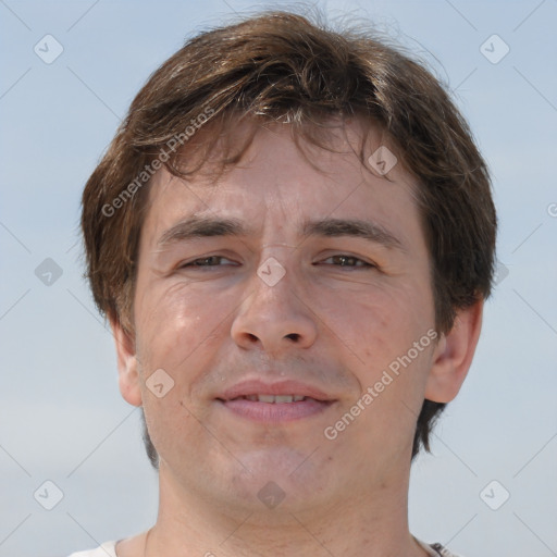 Joyful white adult male with short  brown hair and brown eyes