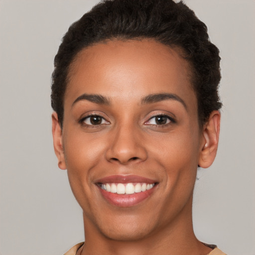 Joyful white young-adult female with short  brown hair and brown eyes