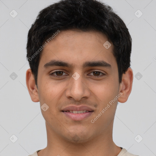 Joyful latino young-adult male with short  black hair and brown eyes