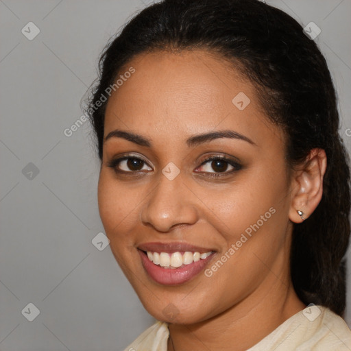 Joyful latino young-adult female with medium  brown hair and brown eyes